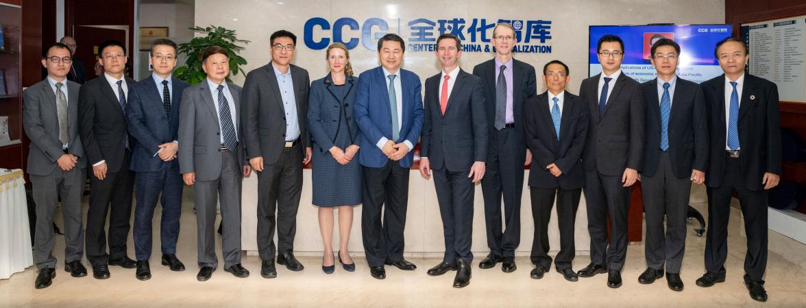 Photo of Simon Birmingham, Graham Fletcher and Dr Wang Yaohui with 10 other people standing infront of a sign that reads Center for China and Globalization. 