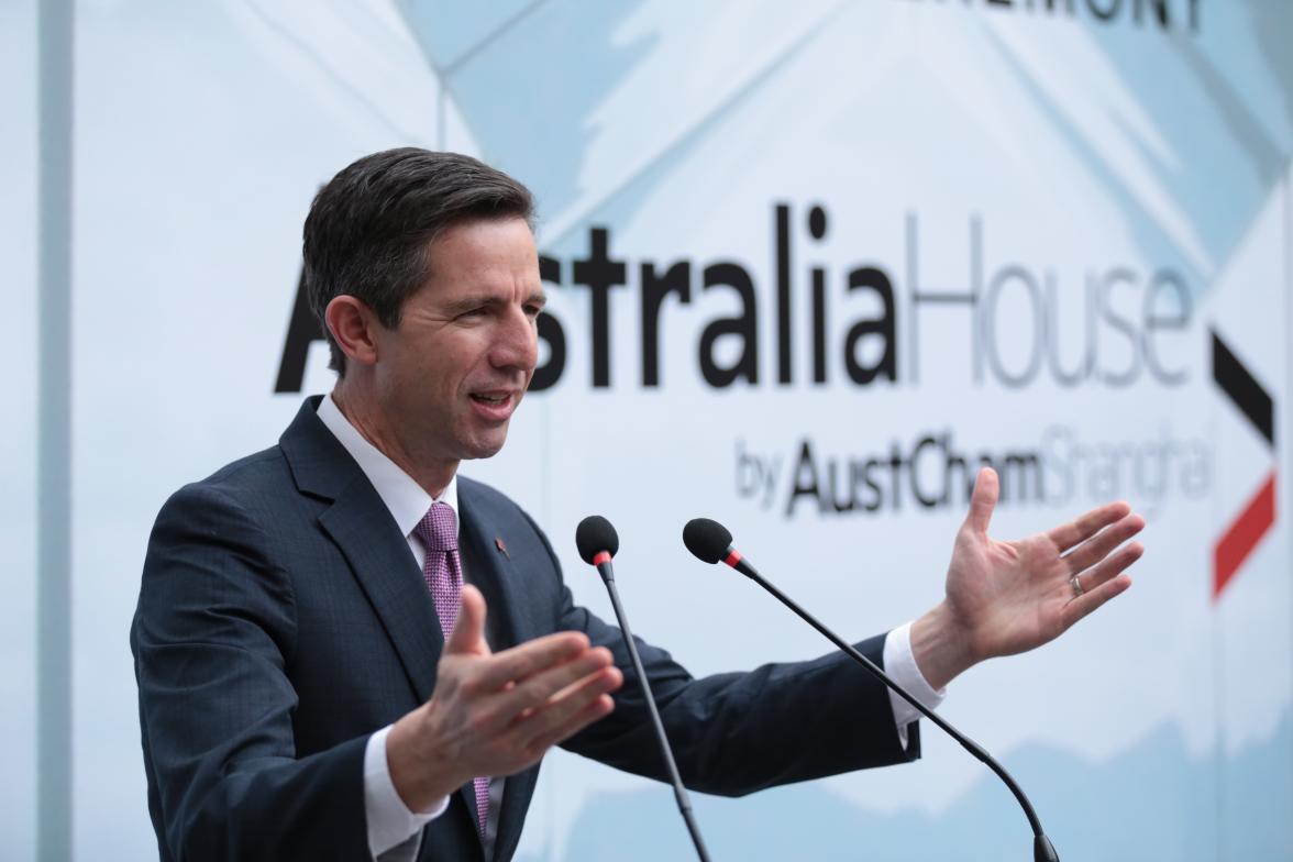 Trade, Tourism and Investment Minister Simon Birmingham addressing a crowd from on stage. 