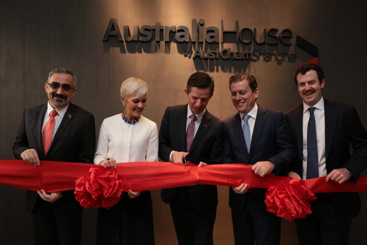 Simon Birmingham, Dr Stephanie Fahey, Craig Aldous and Jack Brady cutting a big red ribbon to open Australia House by AustCham Shanghai.