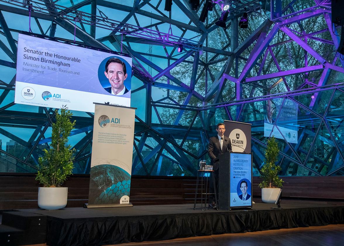 Photo of Minister Birmingham on stage delivering a speech at the 2019 Alfred Deakin Institute Oration.