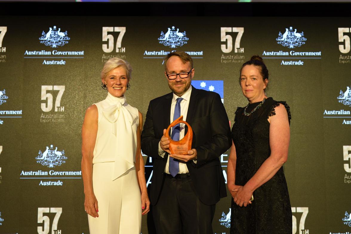 Photo of representative from The University of Adelaide accepting the International Education and Training Winner.