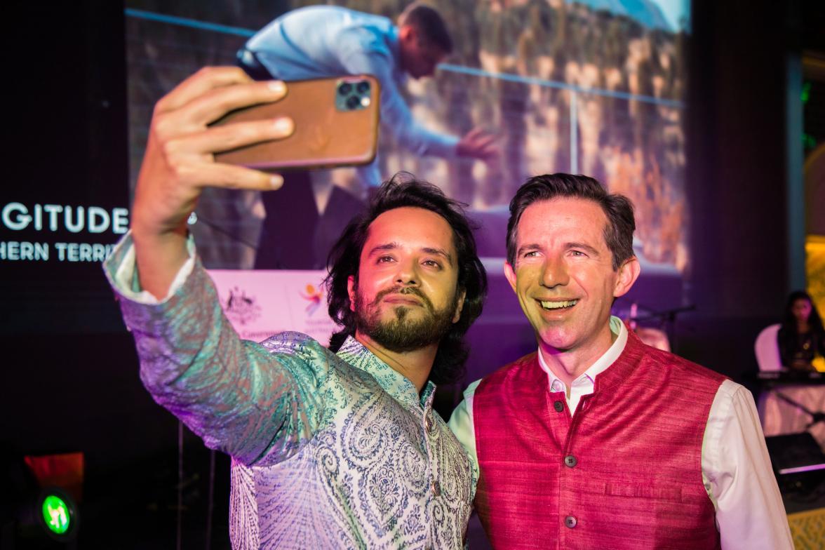 Photo of Minister Simon Birmingham taking a selfie with another gentleman. 