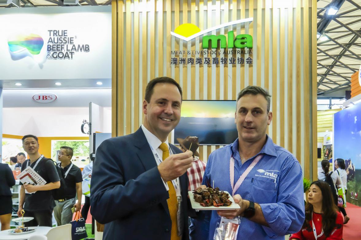 Federal Minister for Trade, Tourism & Investment Steven Ciobo at the Shanghai SIAL Food Industry Expo trying Austrslian beef with the MLA's GM Michael Finucan.Photo credit: DFaT/Chris CrerarHigh res filename reference: 4096