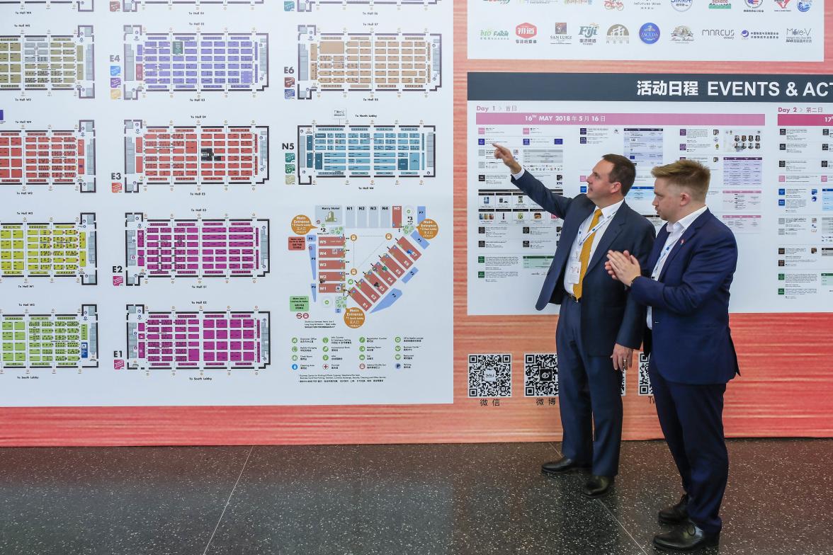 Federal Minister for Trade, Tourism & Investment Steven Ciobo at the Shanghai SIAL Food Industry Expo is shown the locations of Australian exhibitors by AusTrade's Brent Moore.                                      Photo credit: DFaT/Chris Crerar(c)DFaT 