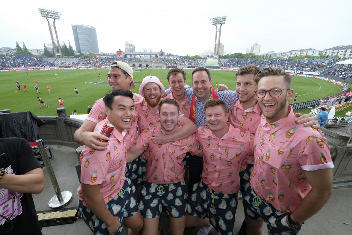 Federal Minister for Trade, Tourism & Investment Steven Ciobo at the AFL match in Shanghai with Port Adelaide fans Watsy's Warriors