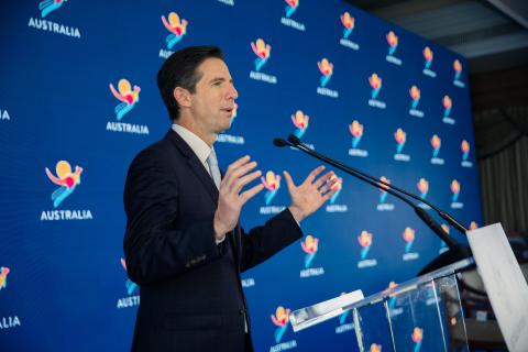 Photo of Minister Simon Birmingham speaking on stage at the Australian Tourism and the T20 World Cup