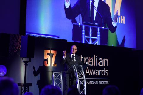 Photo of TV Presenter David Koch speaking on stage at the 57th Australian Export Awards.