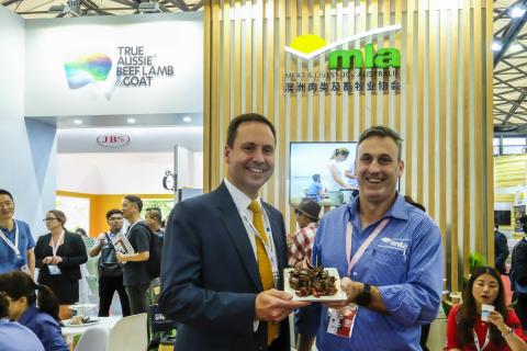 Federal Minister for Trade, Tourism & Investment Steven Ciobo at the Shanghai SIAL Food Industry Expo trying Australian beef with the MLA's GM Michael Finucan.                                                   Photo credit: DFaT/Chris Crerar(c)DFaT Aus