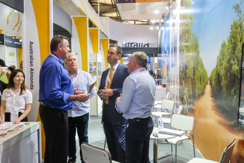 Federal Minister for Trade, Tourism & Investment Steven Ciobo at the Shanghai SIAL Food Industry Expo talking with the team from Australian Almonds at the Australian Pavillion.                                         Photo credit: DFaT/Chris Crerar(c)DF