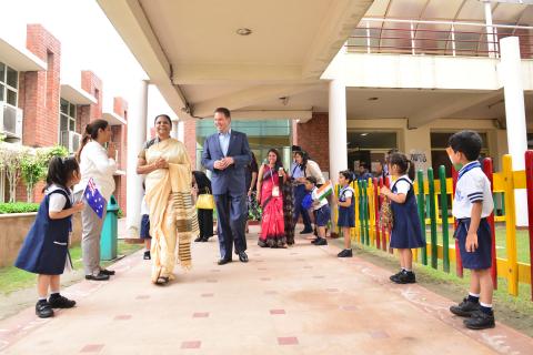 Minister for Trade, Tourism and Investment, the Hon Steven Ciobo MP, being welcomed by young students at Kothari International School in Noida, 31 August 2017. With Ms Manju Gupta, Principal, Kothari International School.