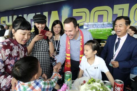 Federal Minister for Trade, Tourism & Investment Steven Ciobo at the AFL match in Shanghai with Shanghai CRED President Gui Guojie & family & friends.                                Photo credit: DFAT/Chris Crerar(c)DFAT Australia / High res filename ref