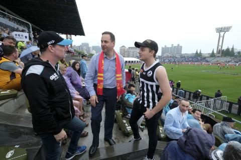 Federal Minister for Trade, Tourism & Investment Steven Ciobo at the AFL match in Shanghai with Port Adelaide fans (L) Robert Blackborough and Senna Blackborough      Photo credit: DFAT/Chris Crerar(c)DFAT Australia / High res filename reference: 7153